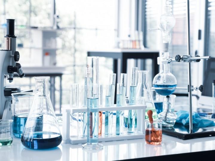 A lab space is displayed with several beakers